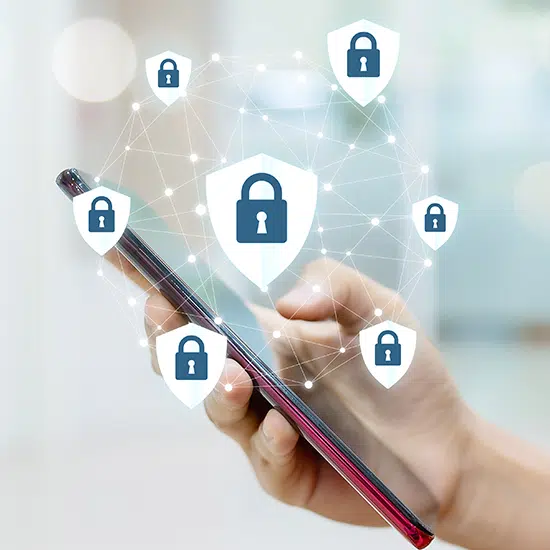 A person completing essential actions to improve their mobile device and endpoint security for remote workforce protection.