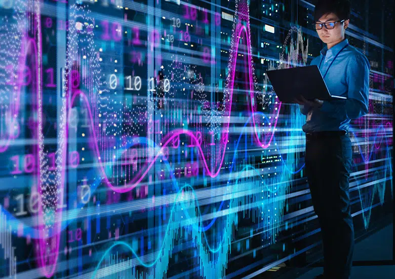 Data analyst with a laptop in front of glowing data visualizations, including charts, graphs, and code